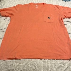 Men Uniqlo Disney Mickey Mickey pocket tee.